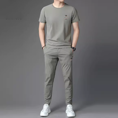 Bộ đồ thể thao và giải trí mới mùa hè của nam giới băng lụa lưới áo thun ngắn tay rộng rãi quần dài nhanh khô - Bộ đồ